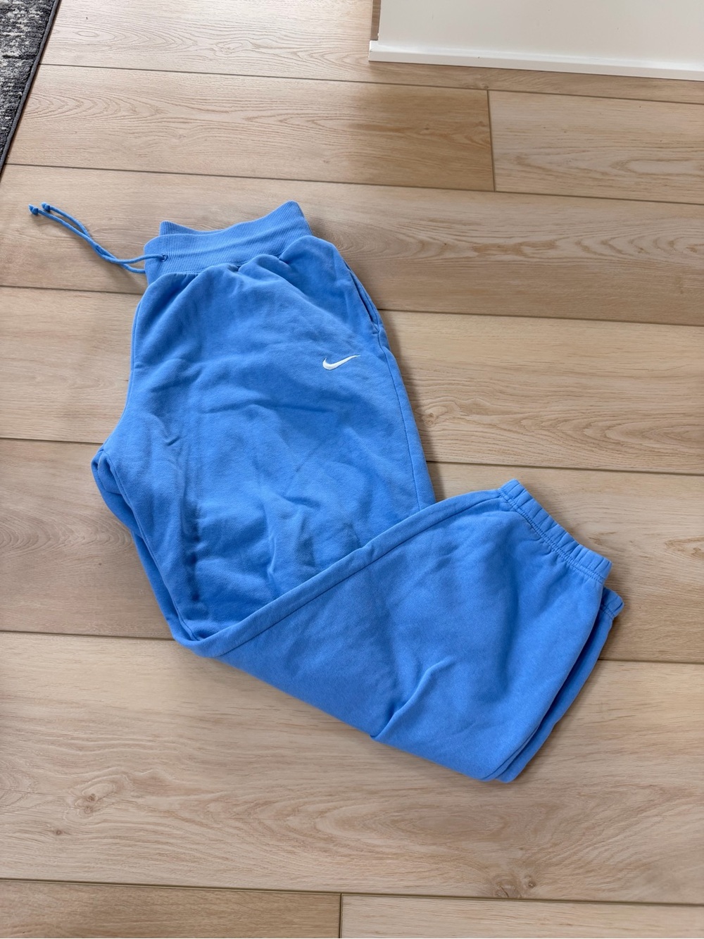 Nike Youth Light Blue Fleece Joggers with White Swoosh